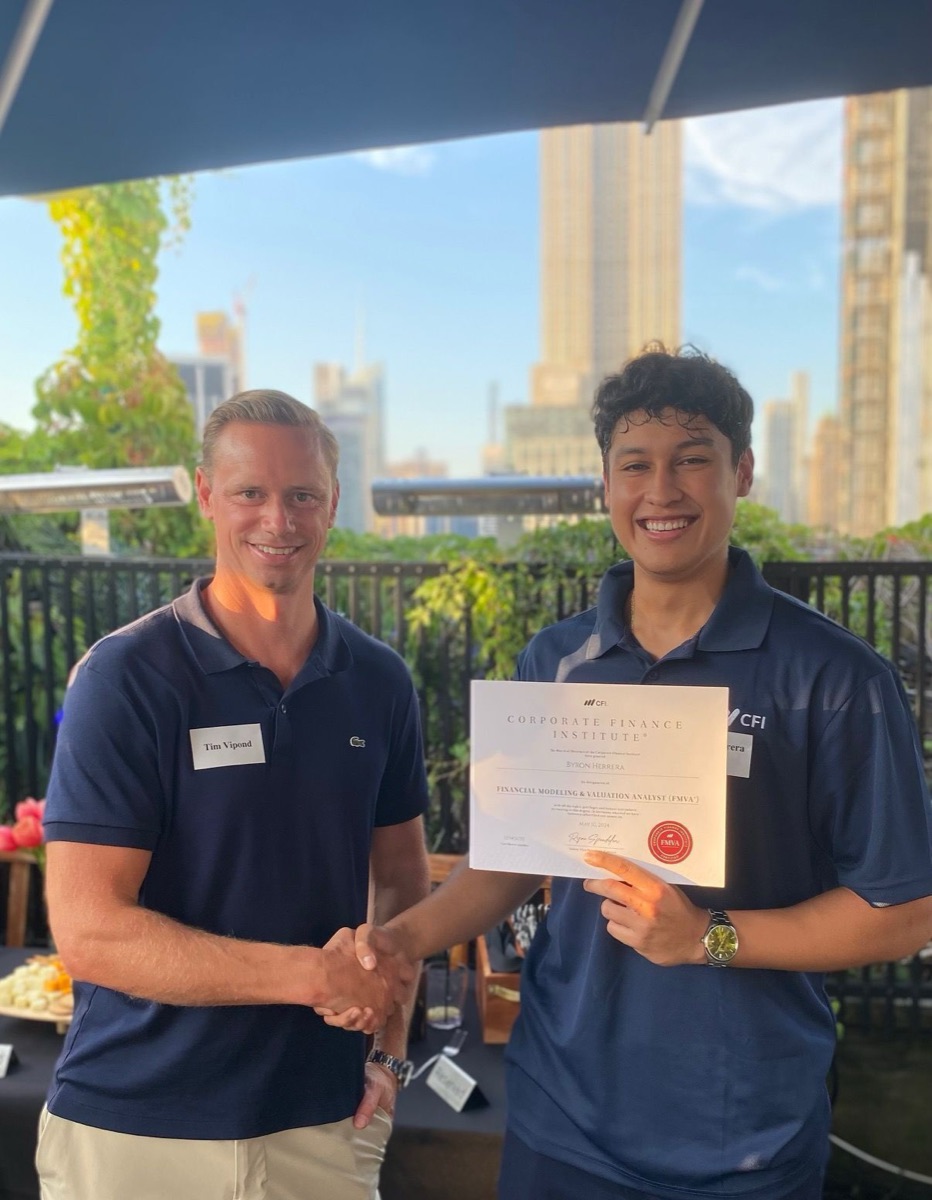 A CFI graduate receiving their certificate at the New York City, USA certification ceremony